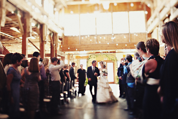 Seattle wedding - Sodo Park - bride walking down the aisle - photo by Seattle based wedding photographer Sean Flanigan 